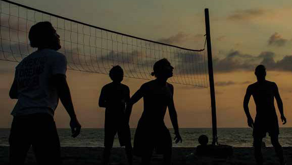 Volleyball players in the night.